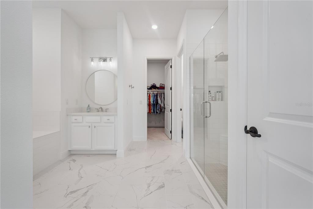 17588 Lake Star Road Winter Garden, FL 34787 - Photo 21 of 57 a bathroom with a sink a toilet and shower