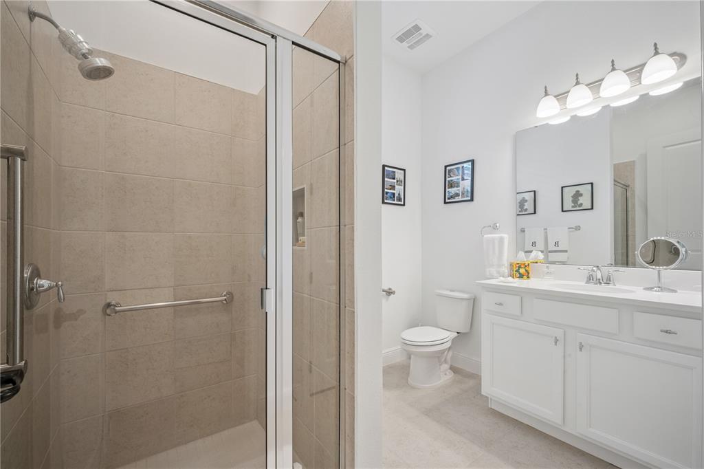 17588 Lake Star Road Winter Garden, FL 34787 - Photo 26 of 57 a view of bathroom with a toilet sink mirror and vanity