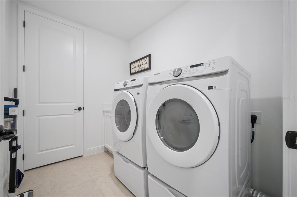 17588 Lake Star Road Winter Garden, FL 34787 - Photo 28 of 57 a utility room with dryer and washer