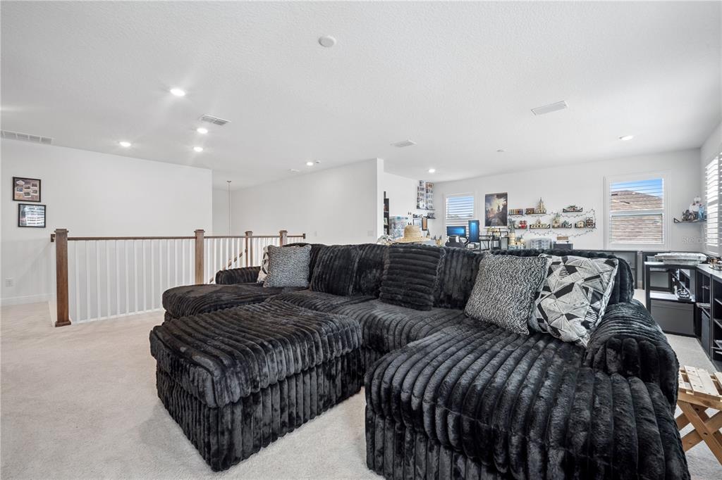 17588 Lake Star Road Winter Garden, FL 34787 - Photo 30 of 57 a living room with furniture and a table