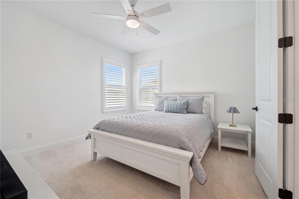 17588 Lake Star Road Winter Garden, FL 34787 - Photo 36 of 57 a bed room with a bed and a chandelier