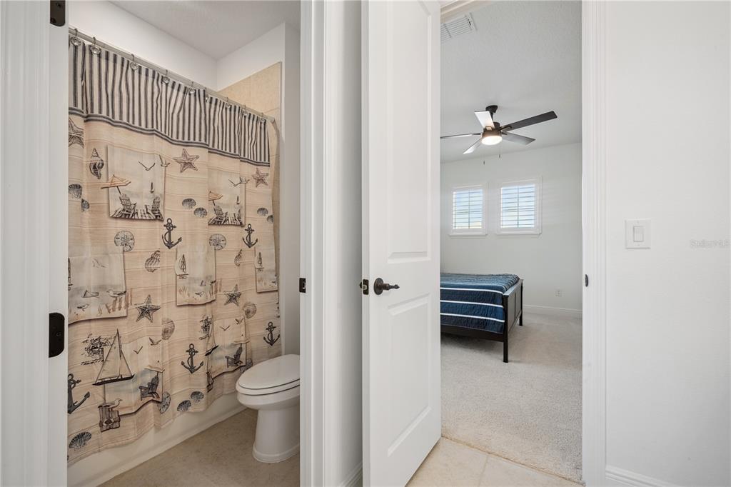 17588 Lake Star Road Winter Garden, FL 34787 - Photo 38 of 57 a bathroom with a toilet and a shower