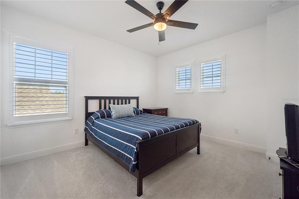 17588 Lake Star Road Winter Garden, FL 34787 - Photo 39 of 57 a bed sitting in a bedroom next to a window