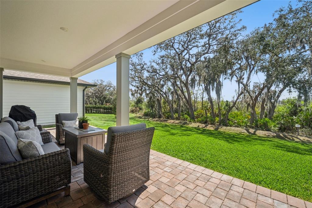 17588 Lake Star Road Winter Garden, FL 34787 - Photo 40 of 57 a view of a patio with couches chairs and a table and chairs