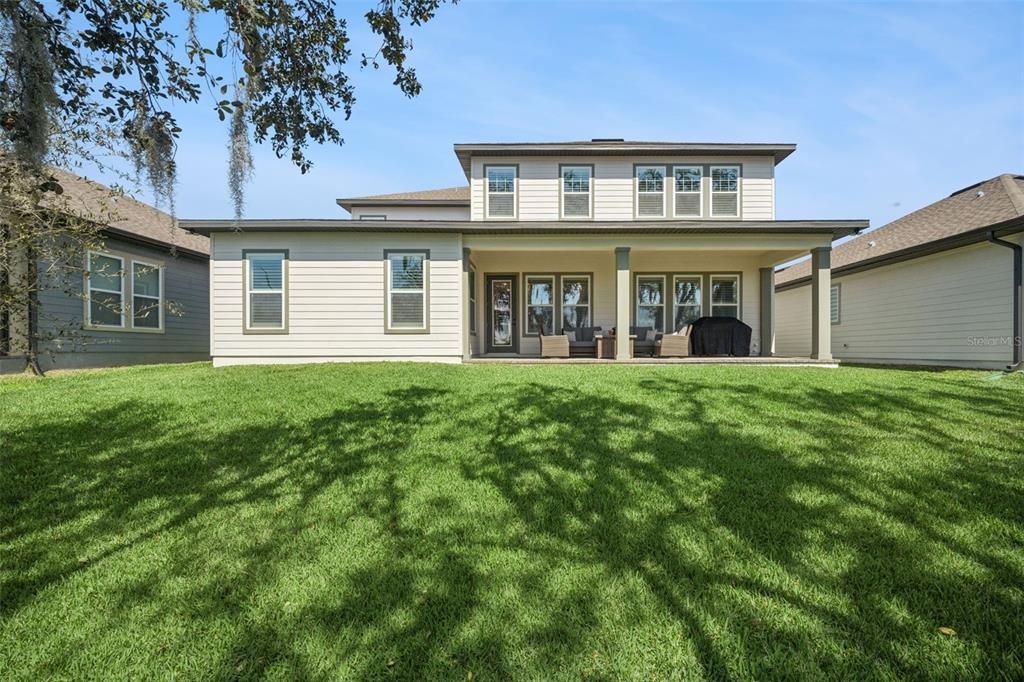 17588 Lake Star Road Winter Garden, FL 34787 - Photo 41 of 57 a front view of a house with a yard and garage