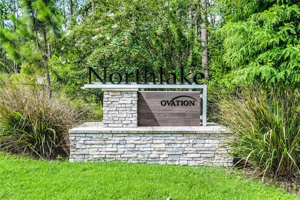 17588 Lake Star Road Winter Garden, FL 34787 - Photo 45 of 57 a sign that is sitting in front of a tree