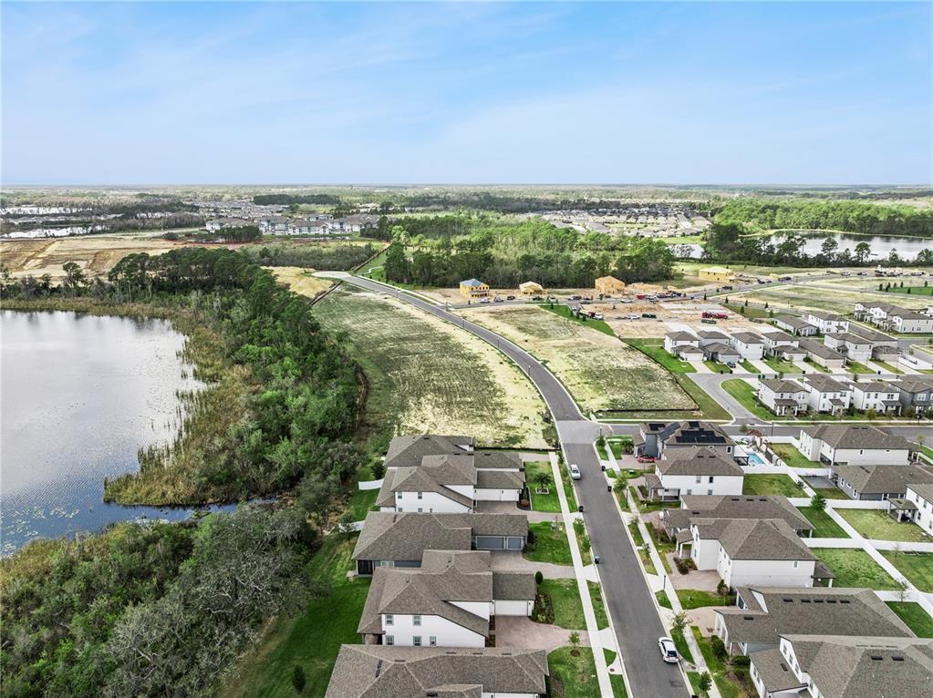 17588 Lake Star Road Winter Garden, FL 34787 - Photo 54 of 57 an aerial view of residential building and lake