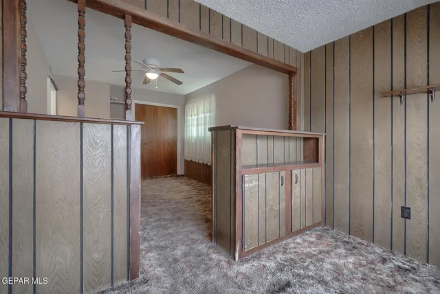 a view of entryway with wooden walls
