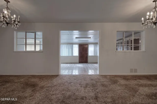 a view of an empty room and window