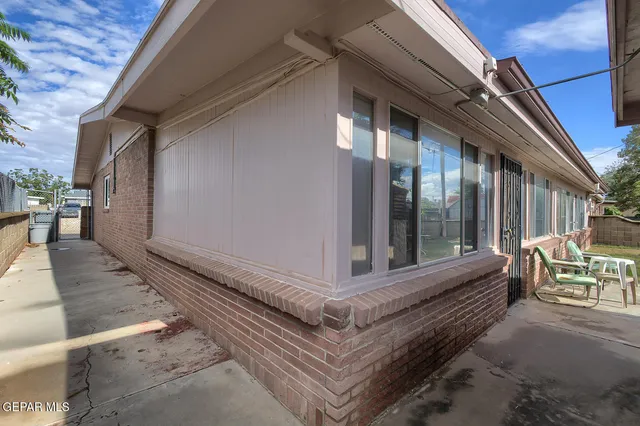 a view of a backyard with a tree