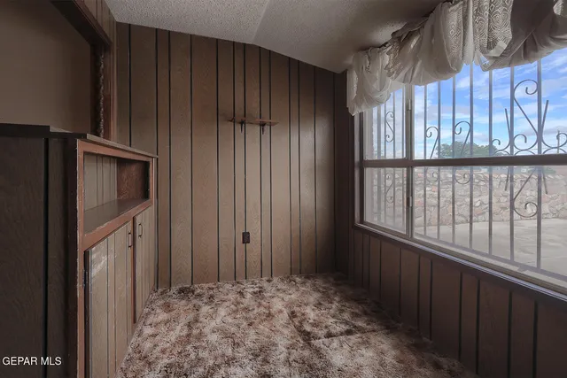 a view of a wooden door and wooden floor