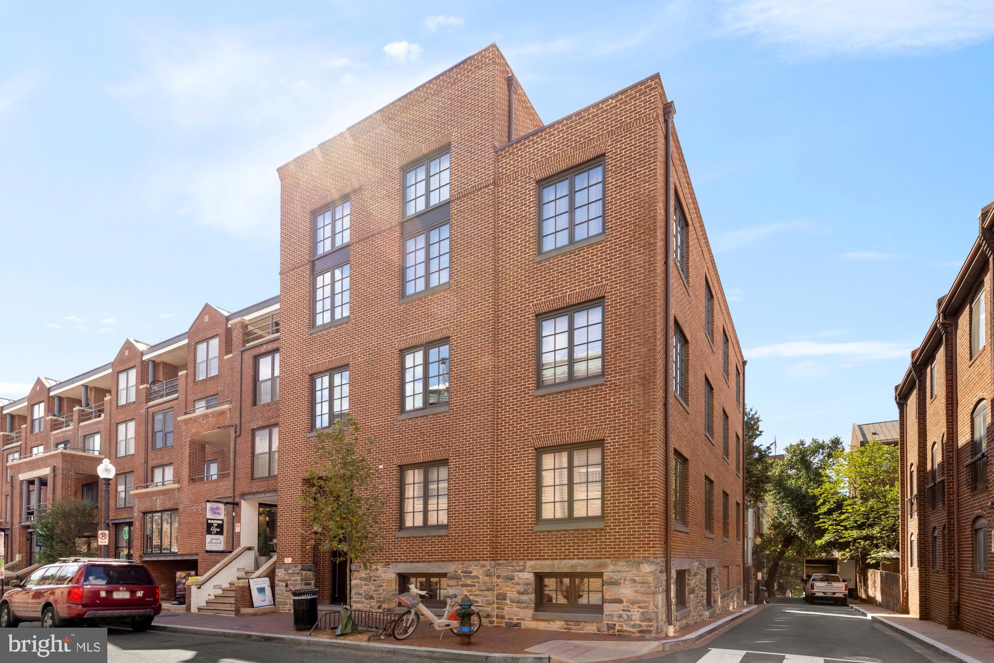 a red building on the side of a street