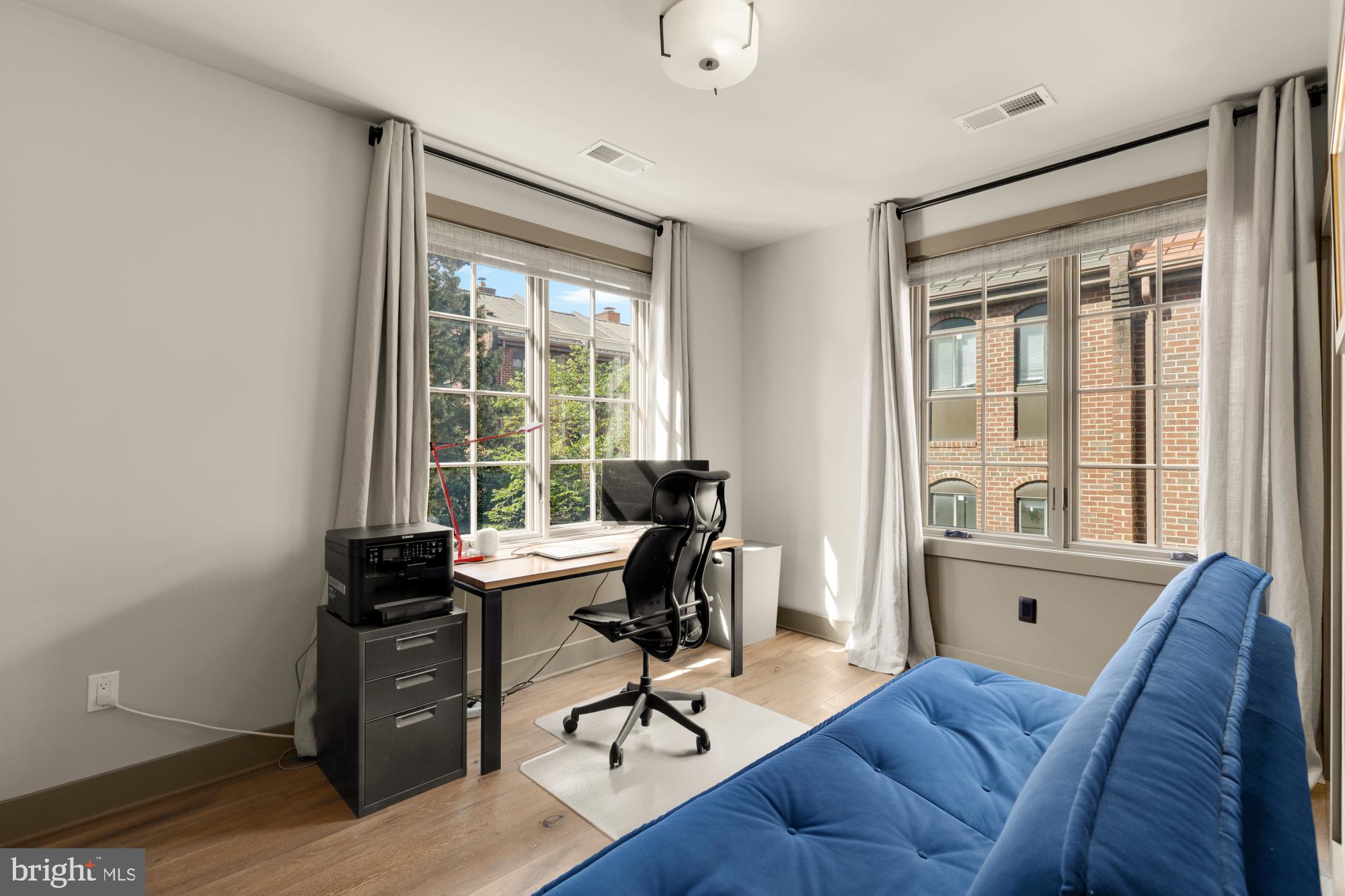 3220 Grace Street Northwest, Unit 5 Washington, DC 20007 - Photo 12 of 19 a view of a workspace with furniture and a window