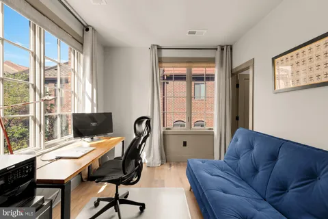 a workspace with furniture and a window