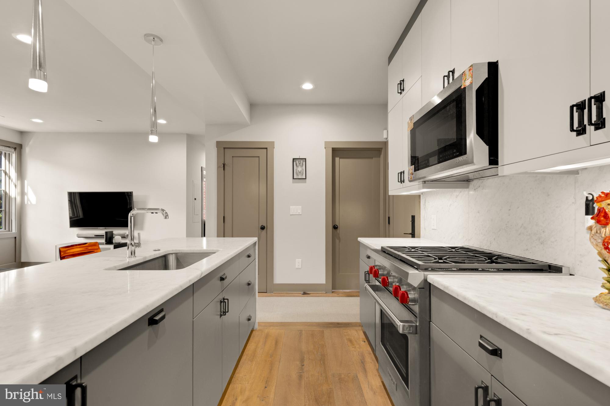 3220 Grace Street Northwest, Unit 5 Washington, DC 20007 - Photo 4 of 19 a kitchen that has a lot of cabinets and appliances