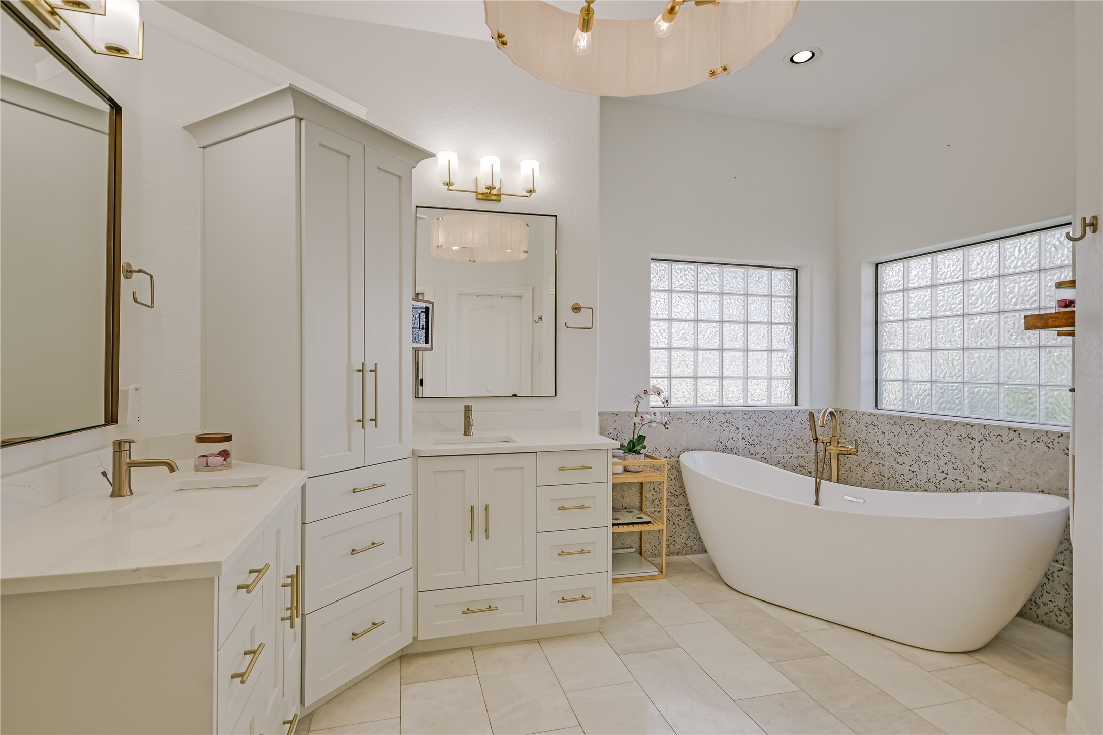 100 Dovetail Lane Georgetown, TX 78628 - Photo 13 of 34 a spacious bathroom with a double vanity sink tub and mirror