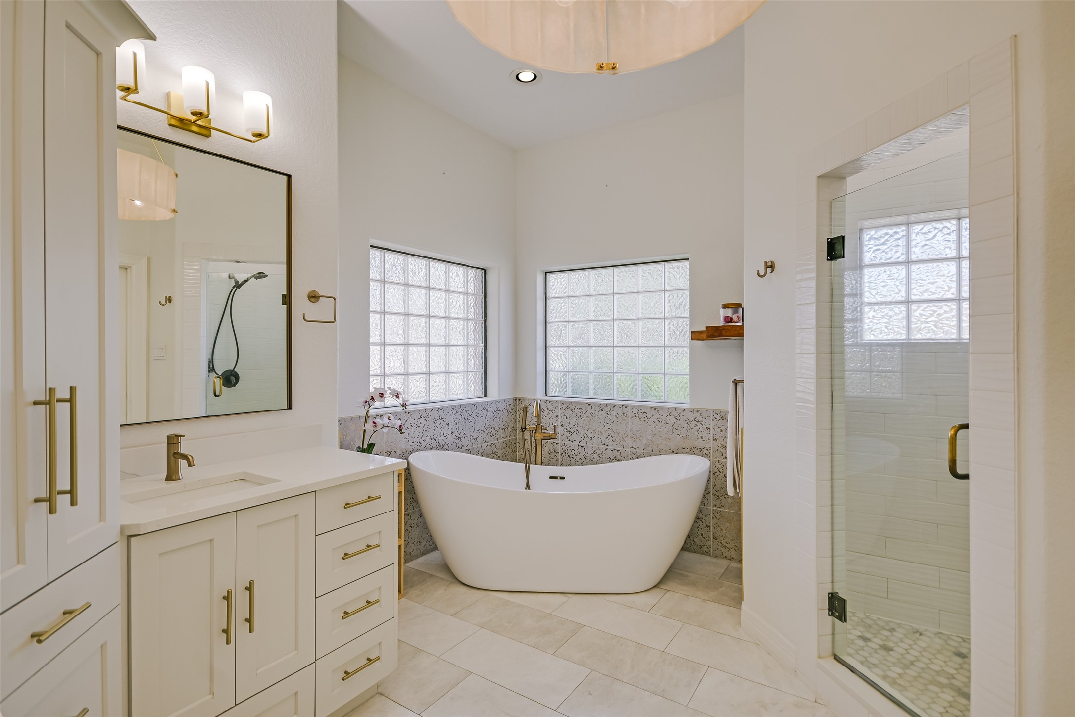 100 Dovetail Lane Georgetown, TX 78628 - Photo 14 of 34 a spacious bathroom with a double vanity sink mirror and double