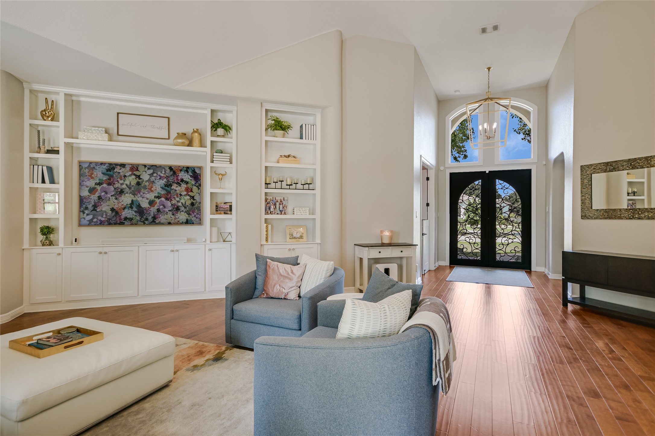 100 Dovetail Lane Georgetown, TX 78628 - Photo 16 of 34 a living room with furniture and a chandelier