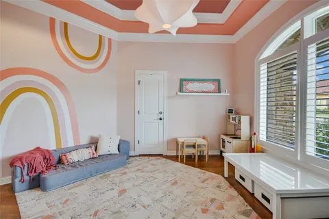 a bedroom with a bed and a chair