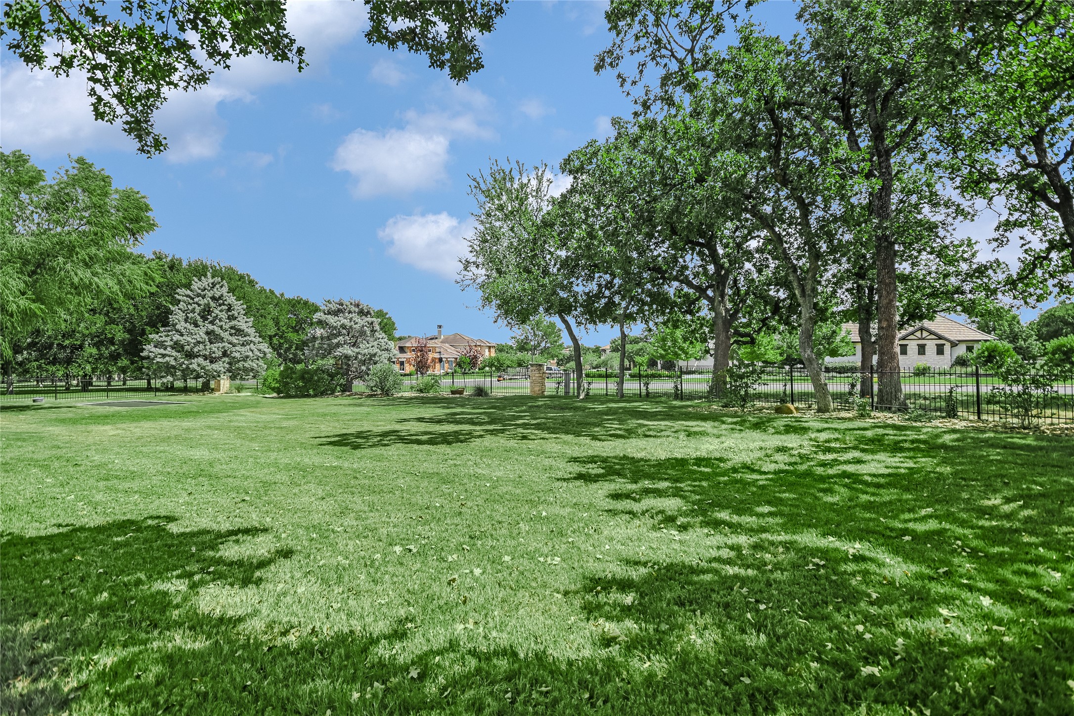 100 Dovetail Lane Georgetown, TX 78628 - Photo 27 of 34 a view of green field with trees in the background