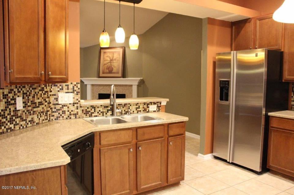 45157 Ingleham Circle Callahan, FL 32011 - Photo 15 of 27 a bathroom with a sink and a mirror
