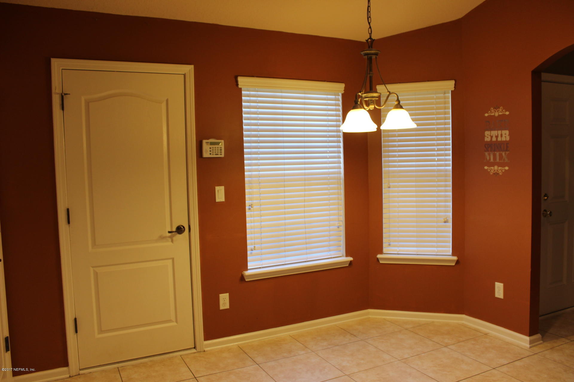 45157 Ingleham Circle Callahan, FL 32011 - Photo 17 of 27 a view of a hallway with a window