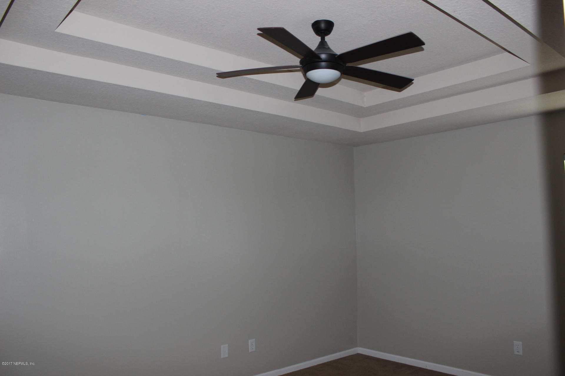 45157 Ingleham Circle Callahan, FL 32011 - Photo 24 of 27 a view of a ceiling fan with wooden floor