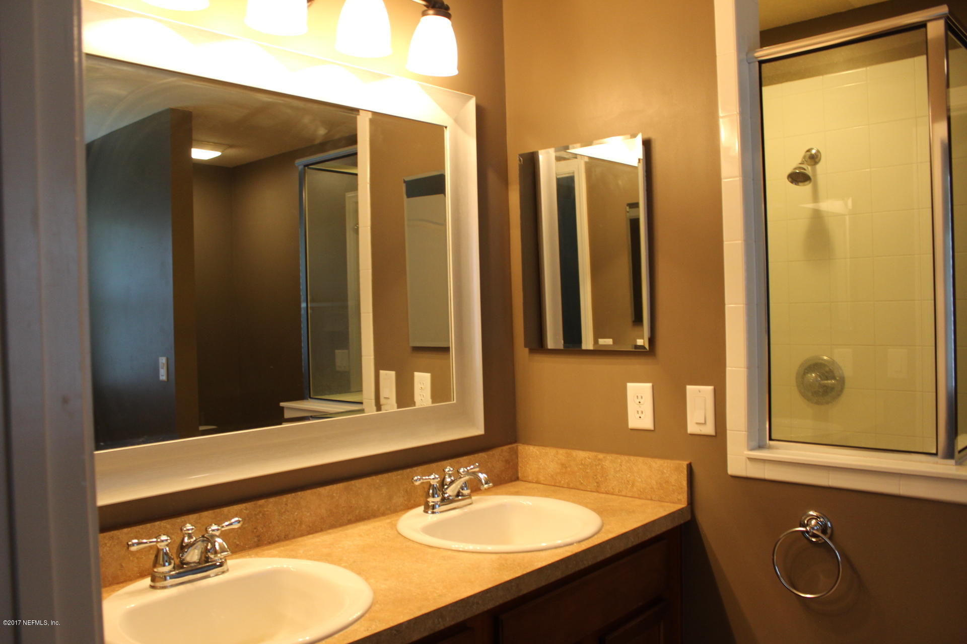 45157 Ingleham Circle Callahan, FL 32011 - Photo 25 of 27 a bathroom with a sink and a mirror
