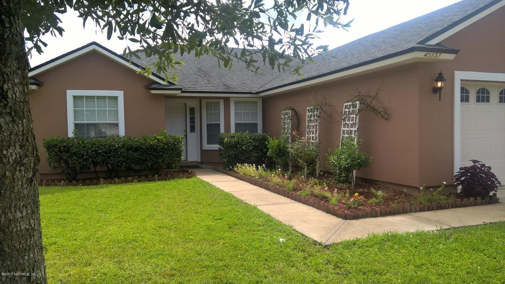 45157 Ingleham Circle Callahan, FL 32011 - Photo 3 of 27 a front view of house with yard and green space