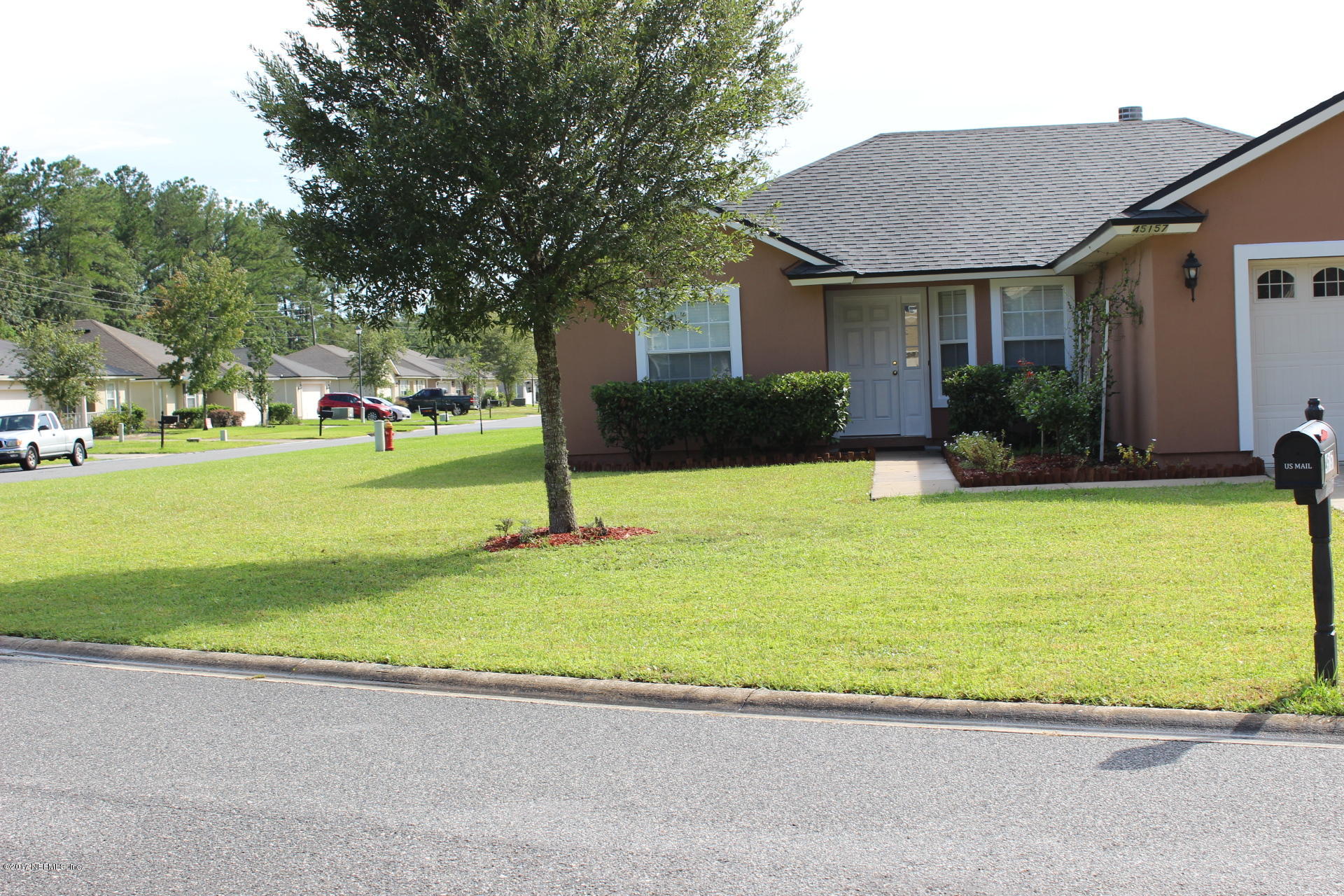 45157 Ingleham Circle Callahan, FL 32011 - Photo 4 of 27 a view of a house with a swimming pool
