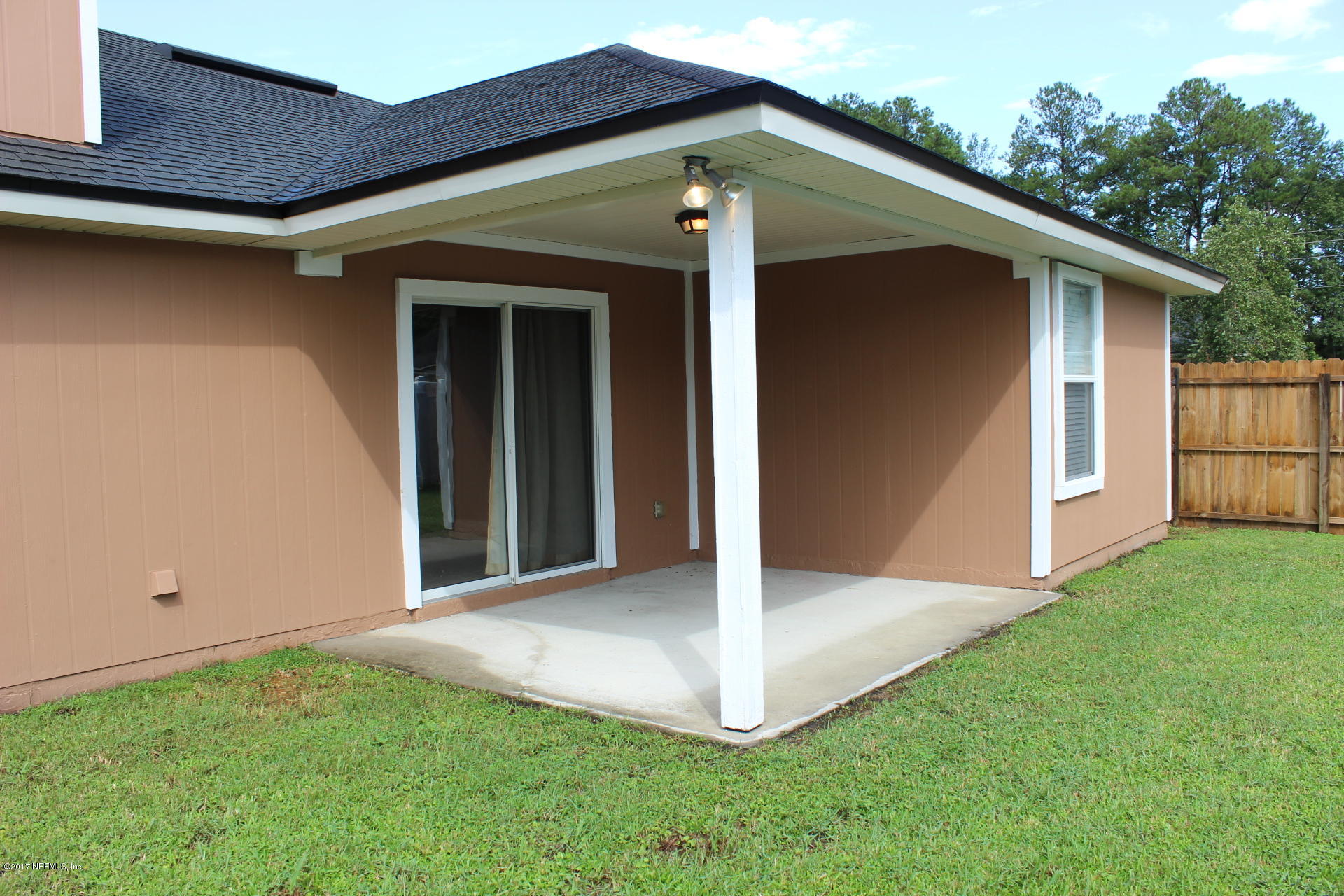 45157 Ingleham Circle Callahan, FL 32011 - Photo 5 of 27 a front view of a house with a yard