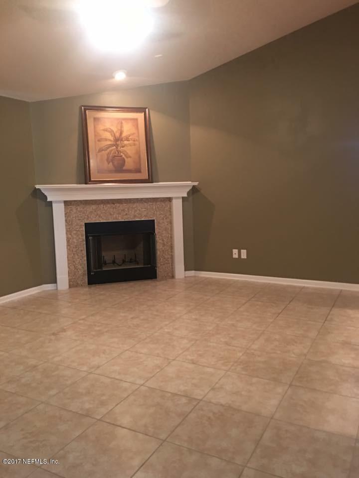 45157 Ingleham Circle Callahan, FL 32011 - Photo 8 of 27 a view of empty room with a fireplace