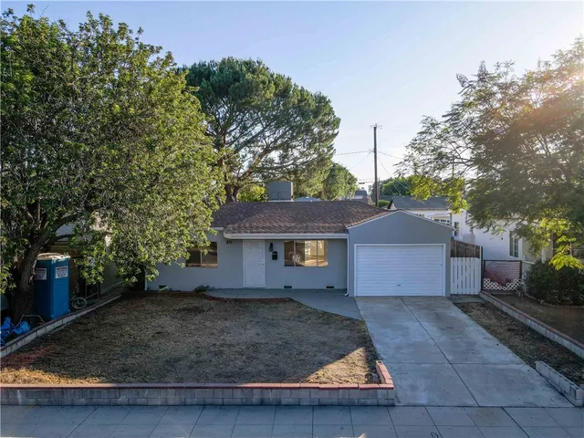 a house view with a backyard space