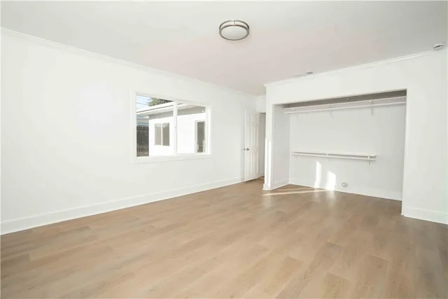 an empty room with a empty space and windows