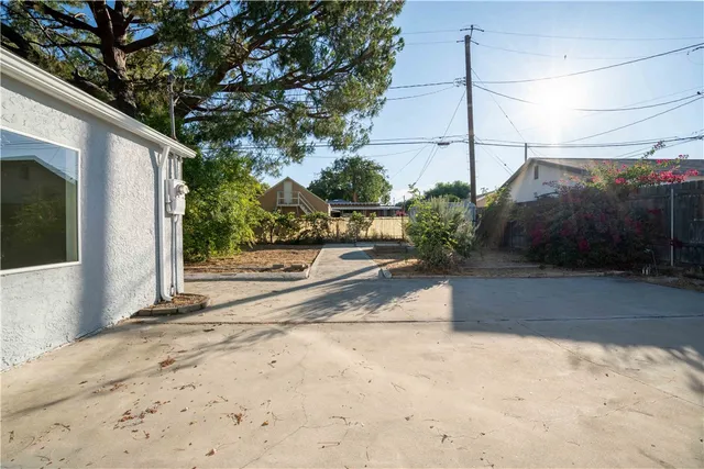 a view of a street with a tree