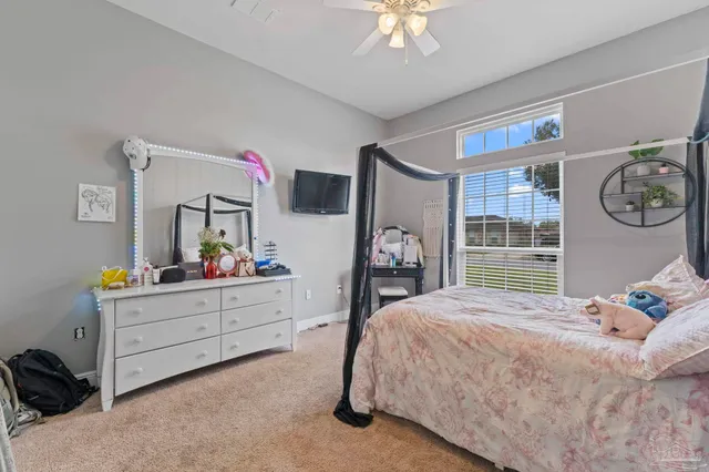 a bedroom with a bed and cabinets