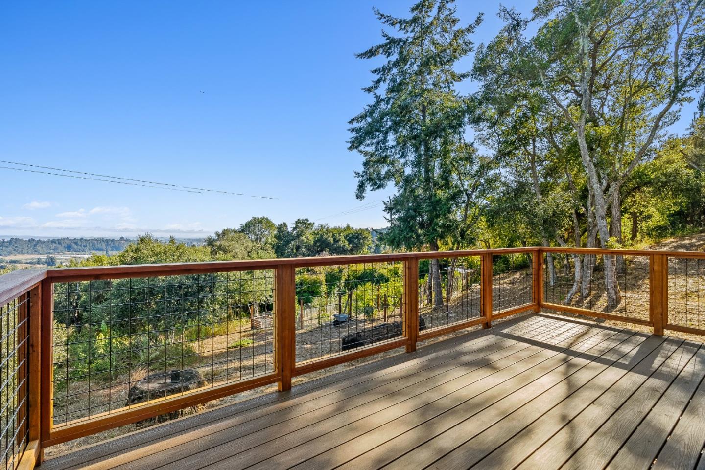 579 San Juan Pass Road Corralitos, CA 95076 - Photo 14 of 56 a view of a balcony with wooden floor