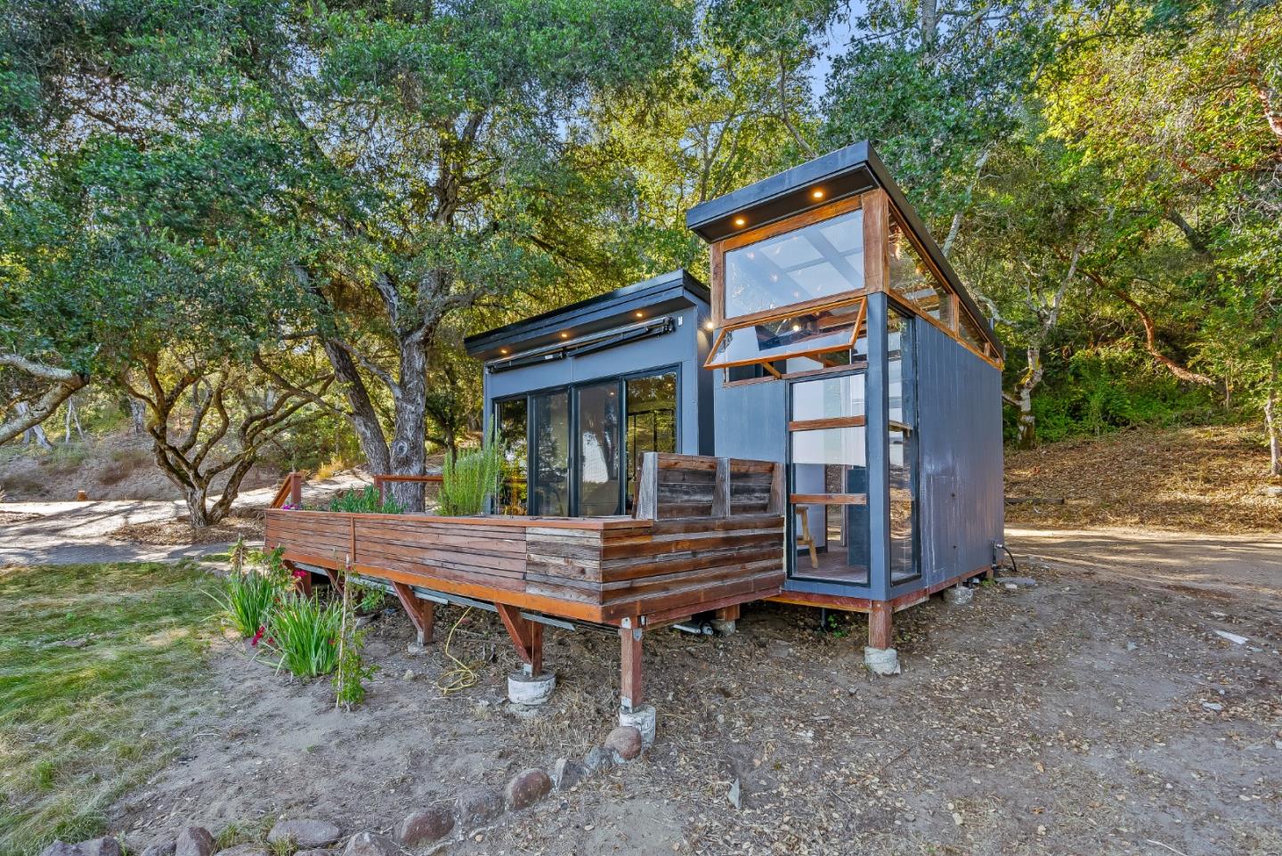 579 San Juan Pass Road Corralitos, CA 95076 - Photo 17 of 56 a wooden bench sitting in front of a house