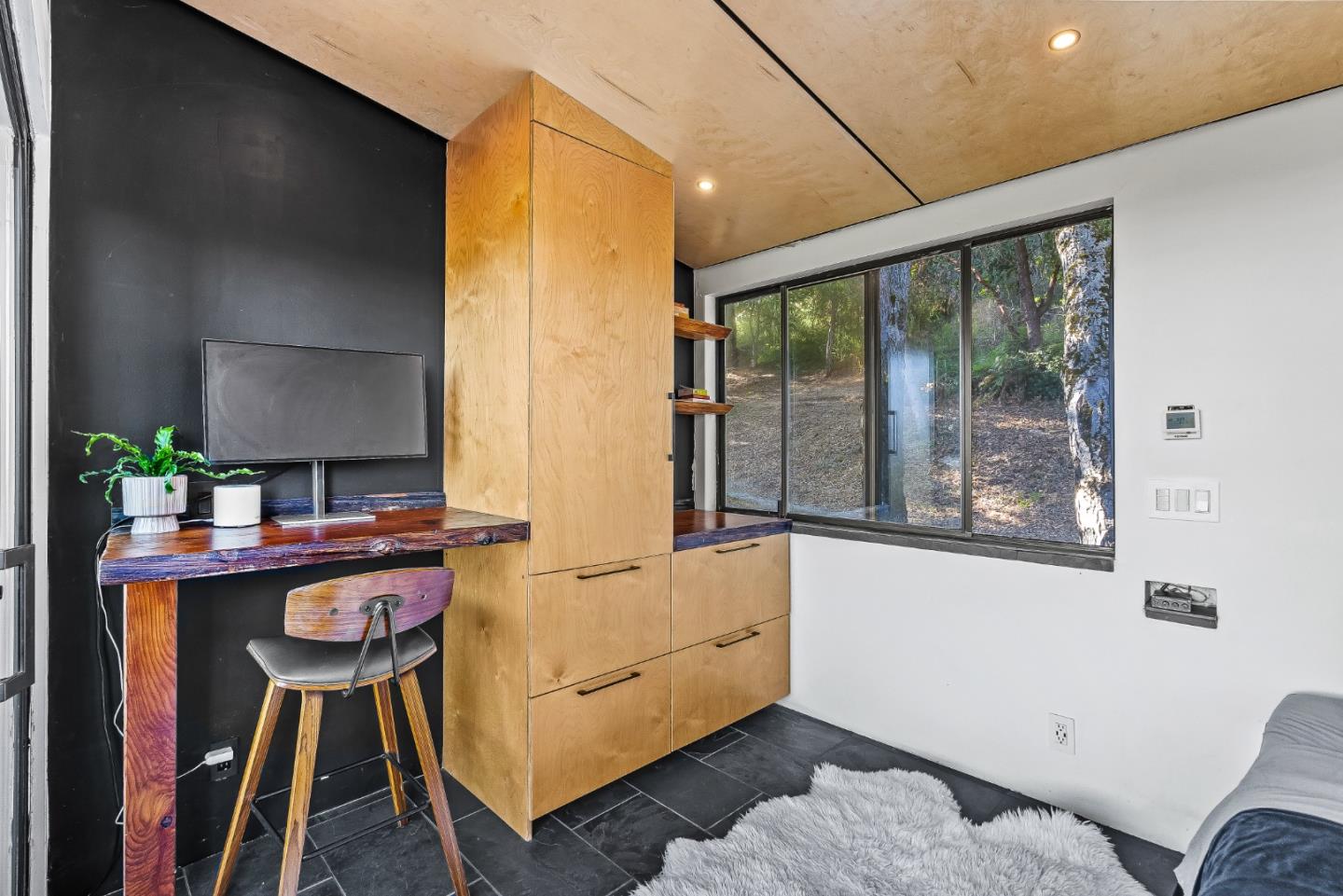579 San Juan Pass Road Corralitos, CA 95076 - Photo 21 of 56 a living room with furniture and a large window