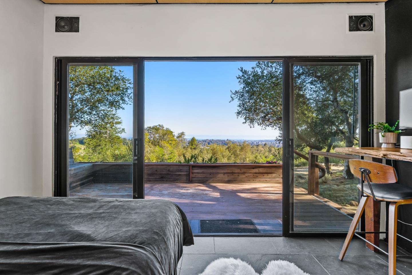 579 San Juan Pass Road Corralitos, CA 95076 - Photo 22 of 56 a bedroom with a bed and large windows