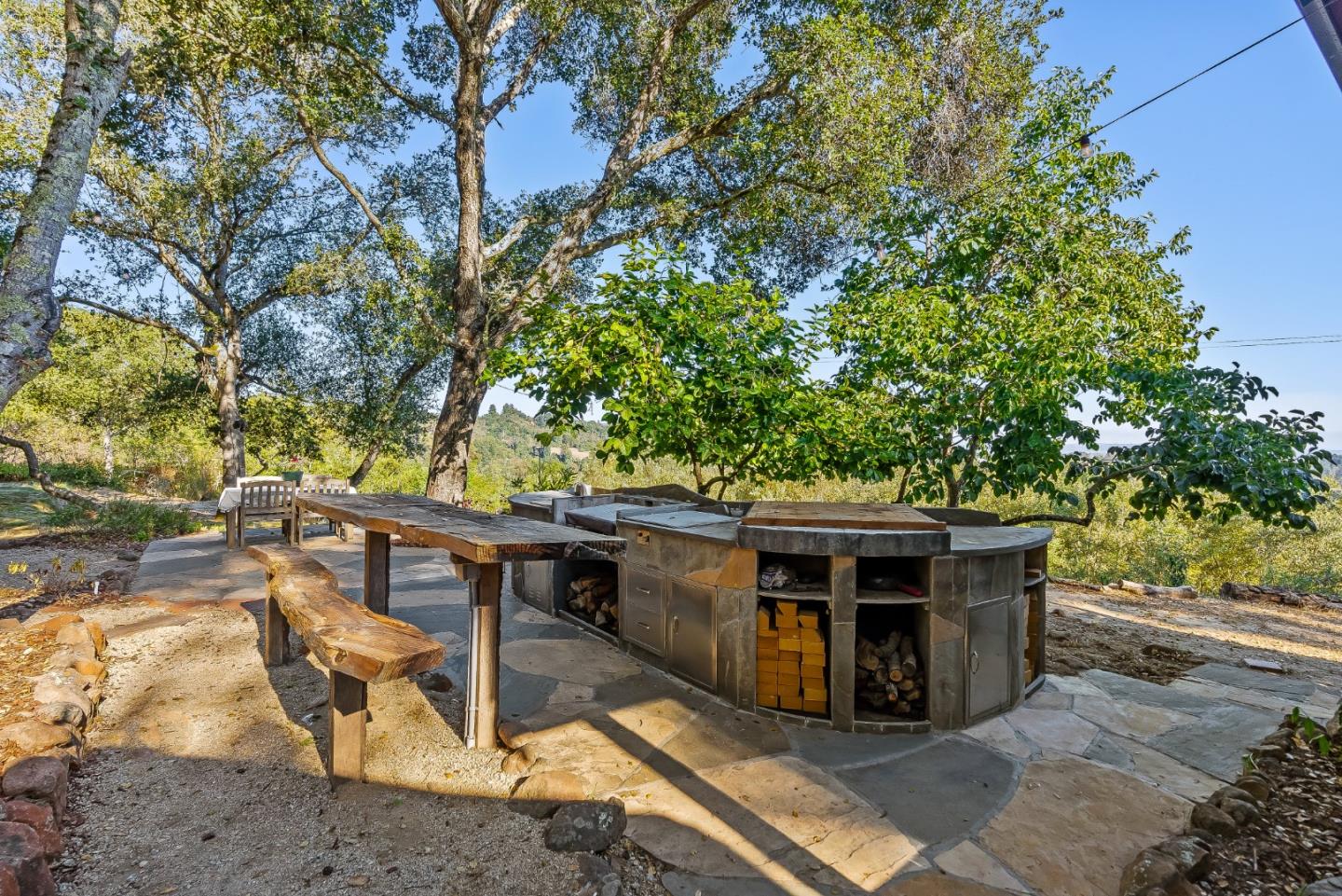 579 San Juan Pass Road Corralitos, CA 95076 - Photo 32 of 56 a view of a wooden deck and a backyard