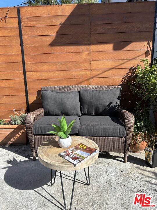 17209 Keswick Street Lake Balboa, CA 91406 - Photo 15 of 19 a living room with furniture and a potted plant