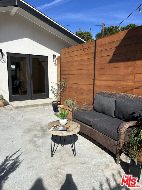 17209 Keswick Street Lake Balboa, CA 91406 - Photo 16 of 19 a outdoor living space with furniture and a ceiling fan