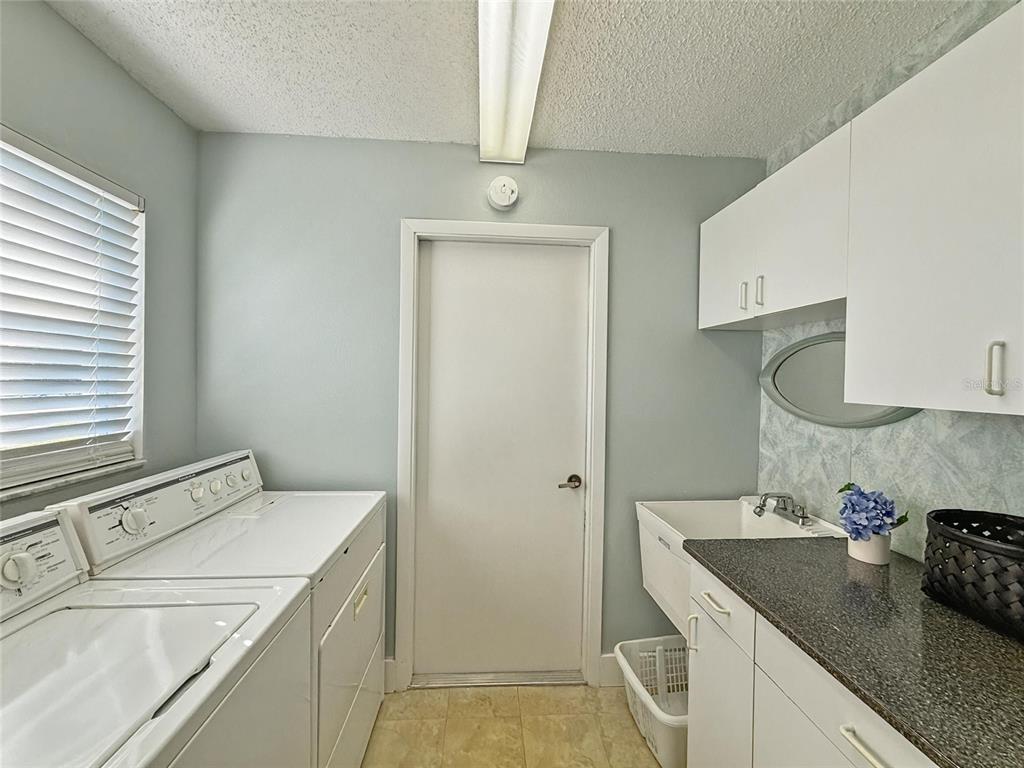 2436 Deer Trail Lane Spring Hill, FL 34606 - Photo 11 of 56 a bathroom with a sink a vanity and a mirror