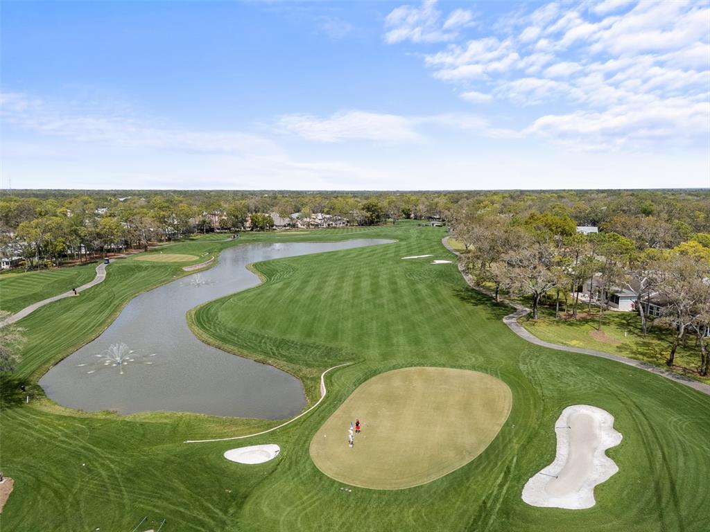 2436 Deer Trail Lane Spring Hill, FL 34606 - Photo 25 of 56 a view of a lake with a yard