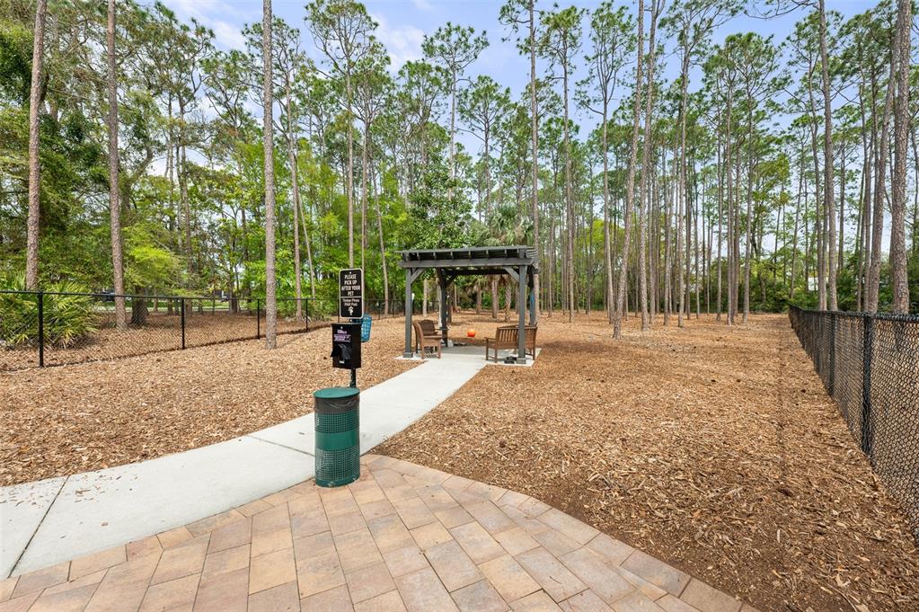2436 Deer Trail Lane Spring Hill, FL 34606 - Photo 32 of 56 a view of a park with trees and plants