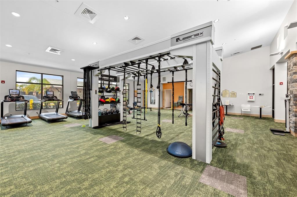 2436 Deer Trail Lane Spring Hill, FL 34606 - Photo 41 of 56 a view of a room with gym equipment