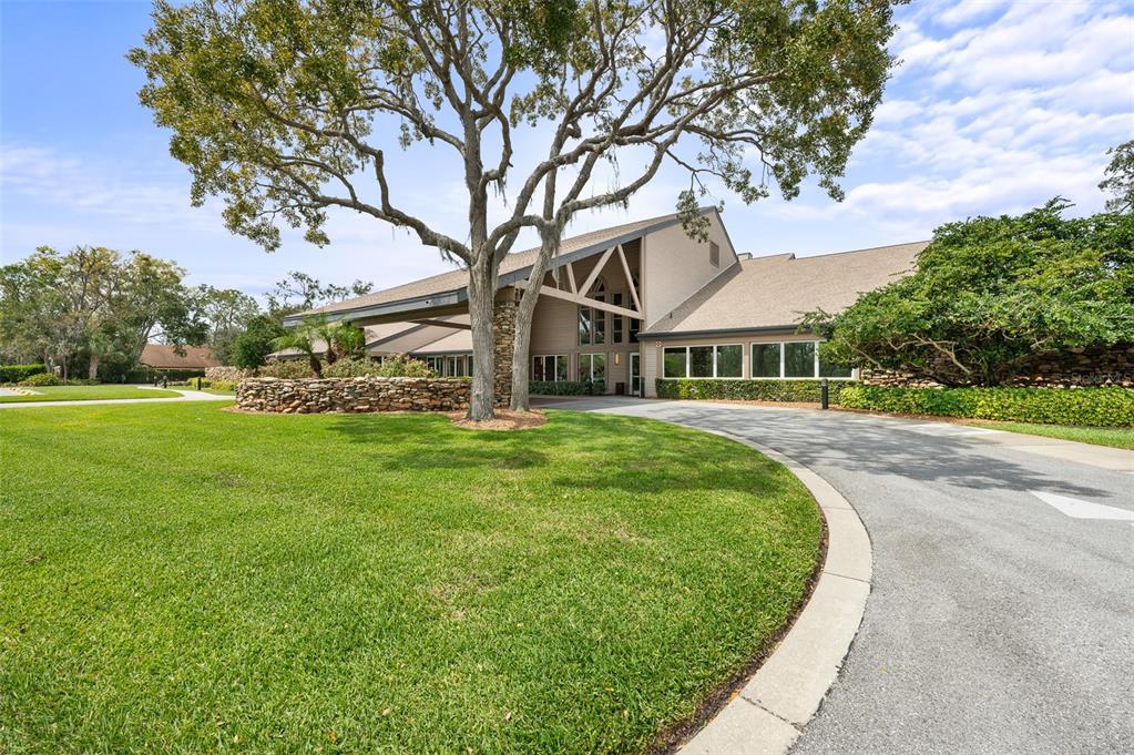 2436 Deer Trail Lane Spring Hill, FL 34606 - Photo 47 of 56 a view of a white house with a big yard and large tree