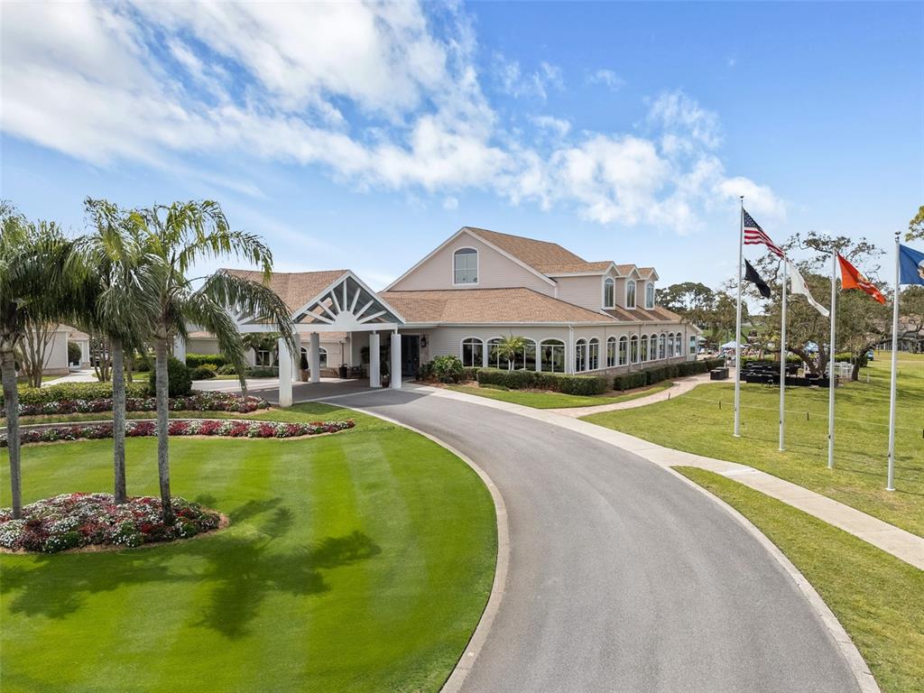 2436 Deer Trail Lane Spring Hill, FL 34606 - Photo 51 of 56 a view of a house with swimming pool and a yard