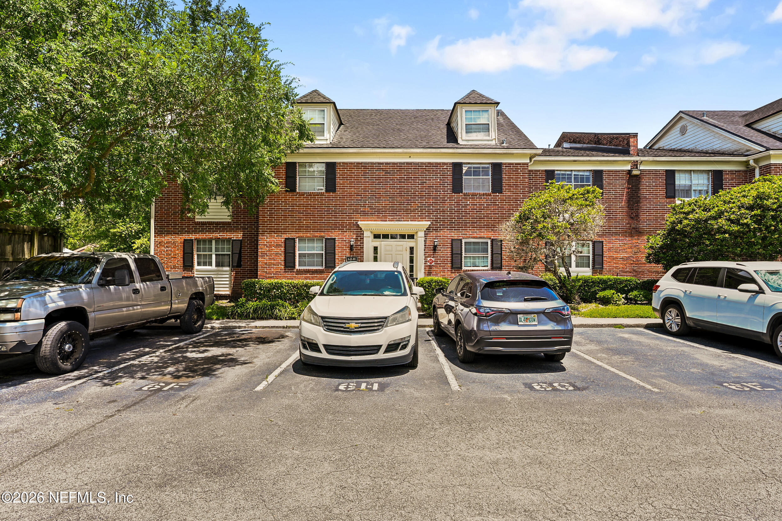 4915 Baymeadows Road, Unit 6G Jacksonville, FL 32217 - Photo 2 of 44 a front view of a house with parking space